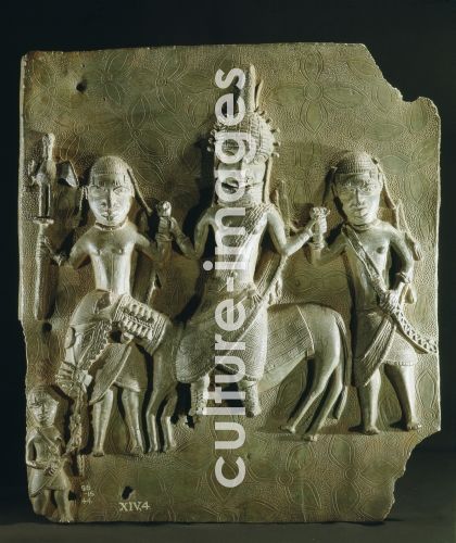 Benin brass plaque from the palace, depicting an Oba on horseback supported by two retainers Benin brass plaque from the palace, depicting an Oba on horseback supported by two retainers
